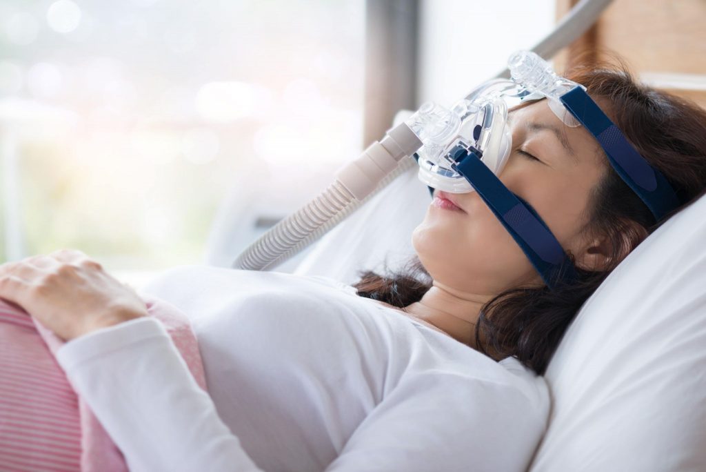 Patient using a CPAP mask for sleep apnea